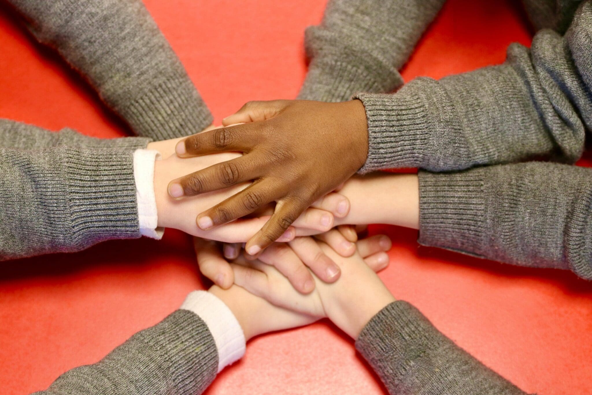 A stacked hands of a team